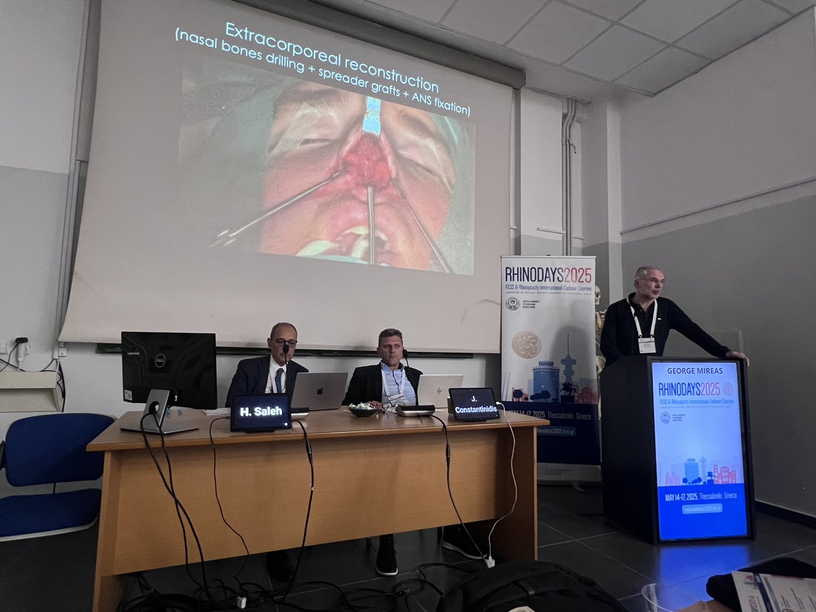 Dr George Mireas presenting rhinoplasty techniques lecture at RhinoDays 2025 cadaver course Thessaloniki