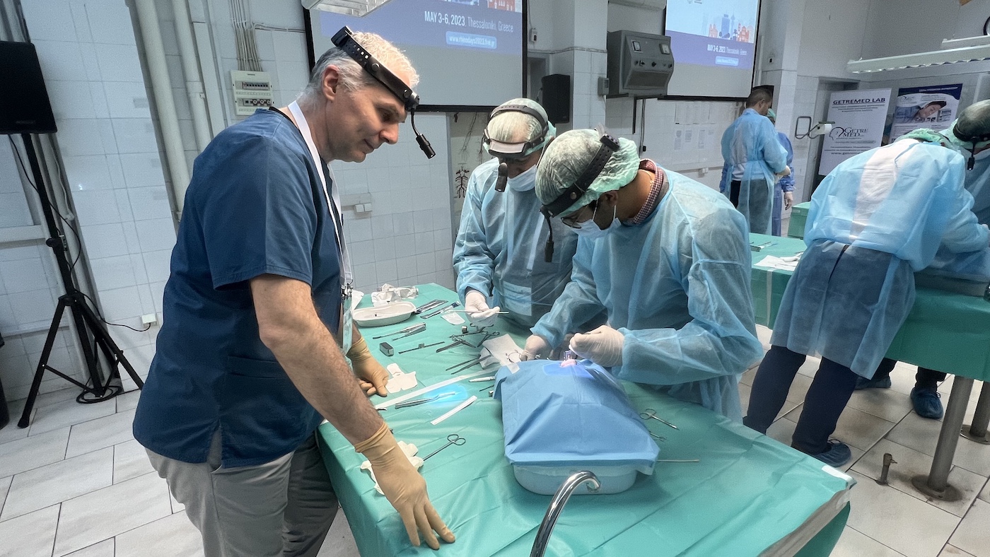 Dr George Mireas supervising hands-on rhinoplasty cadaver dissection during RHINODAYS 2023 in Thessaloniki